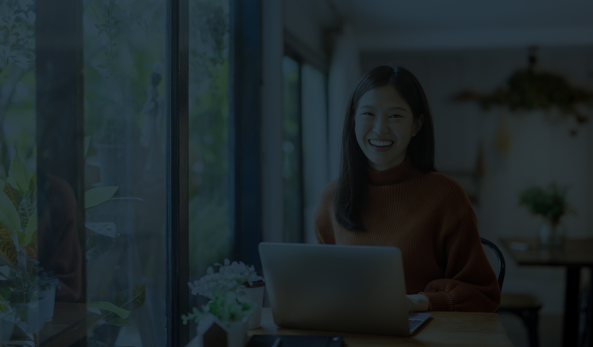 smiling woman at computer